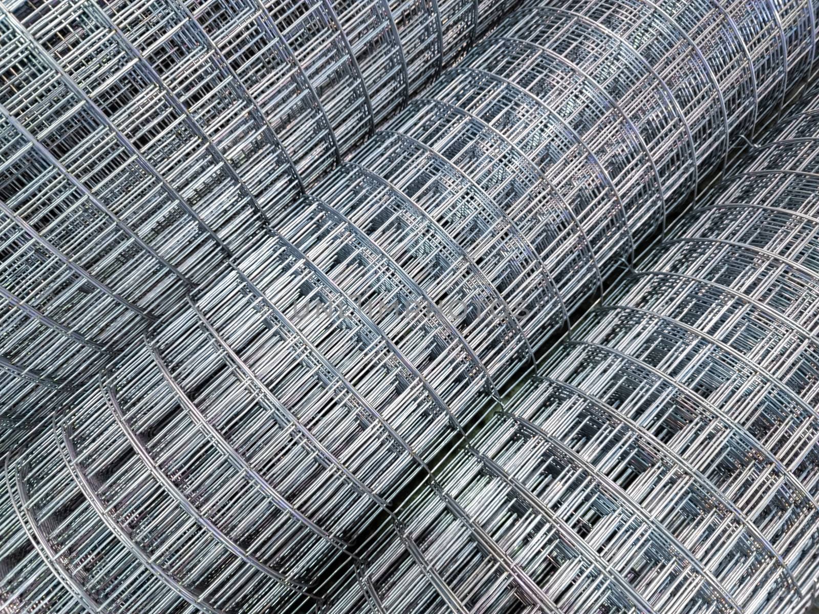 zync plated wired square mesh rolls close-up full frame background with selective focus