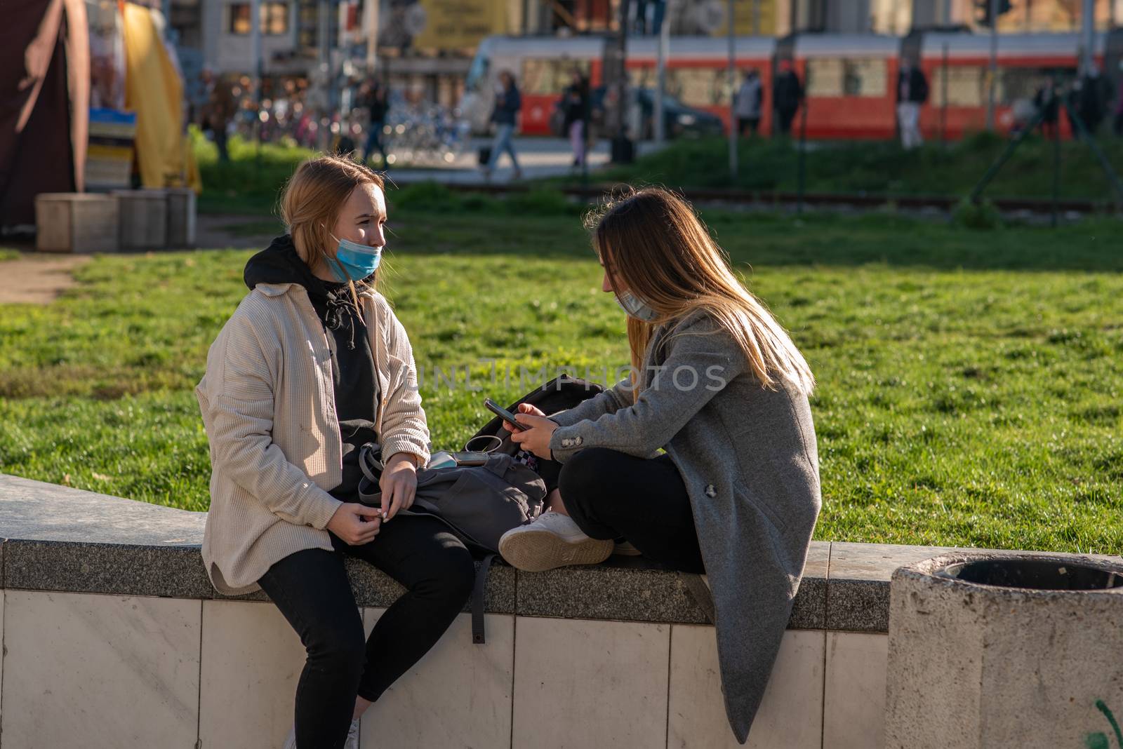 11-22-2020. Prague, Czech Republic. People during quarantine period due to coronavirus (COVID-19) at Hradcanska metro stop in Prague 6. Girlfriends talking.