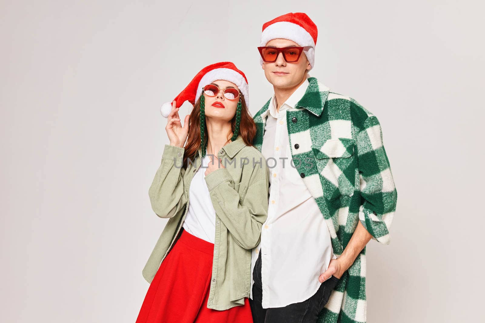 men and women new year sunglasses christmas studio together. High quality photo