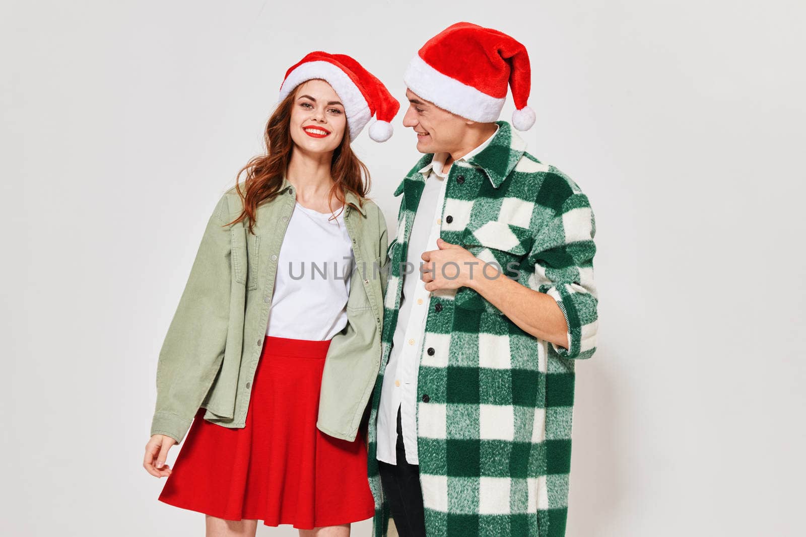 Cheerful man and woman Christmas holiday gifts friendship winter. High quality photo