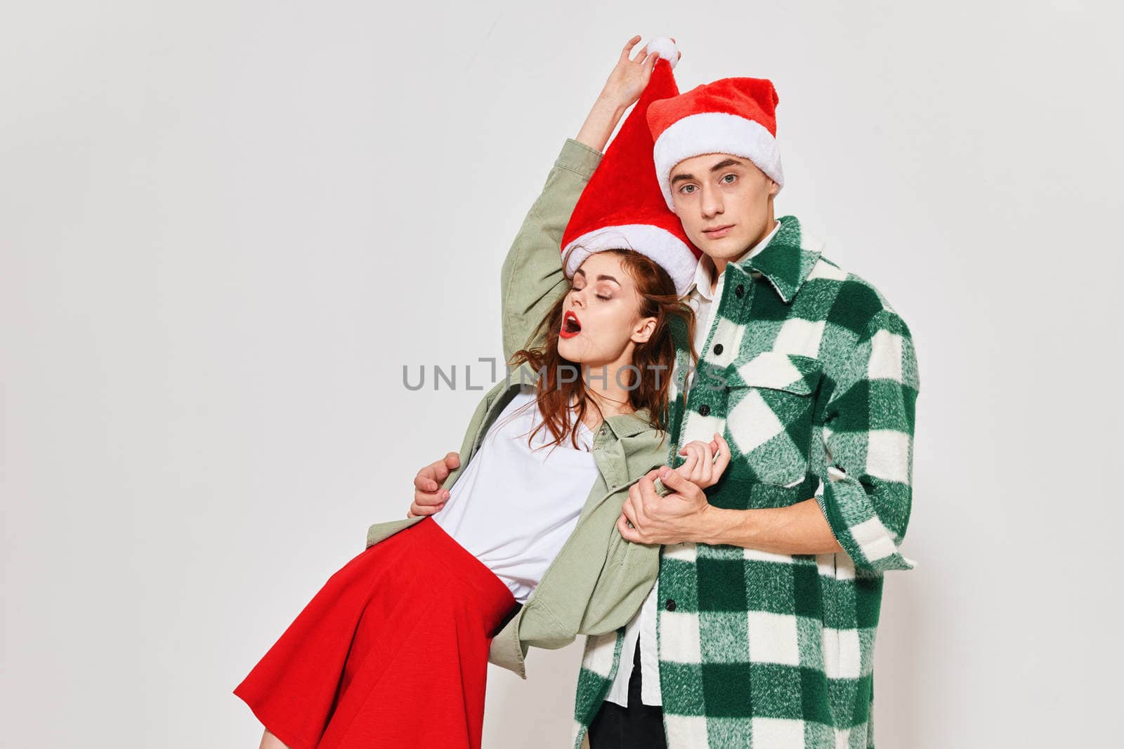 Cute young couple new year clothes attractive look holiday fun. High quality photo