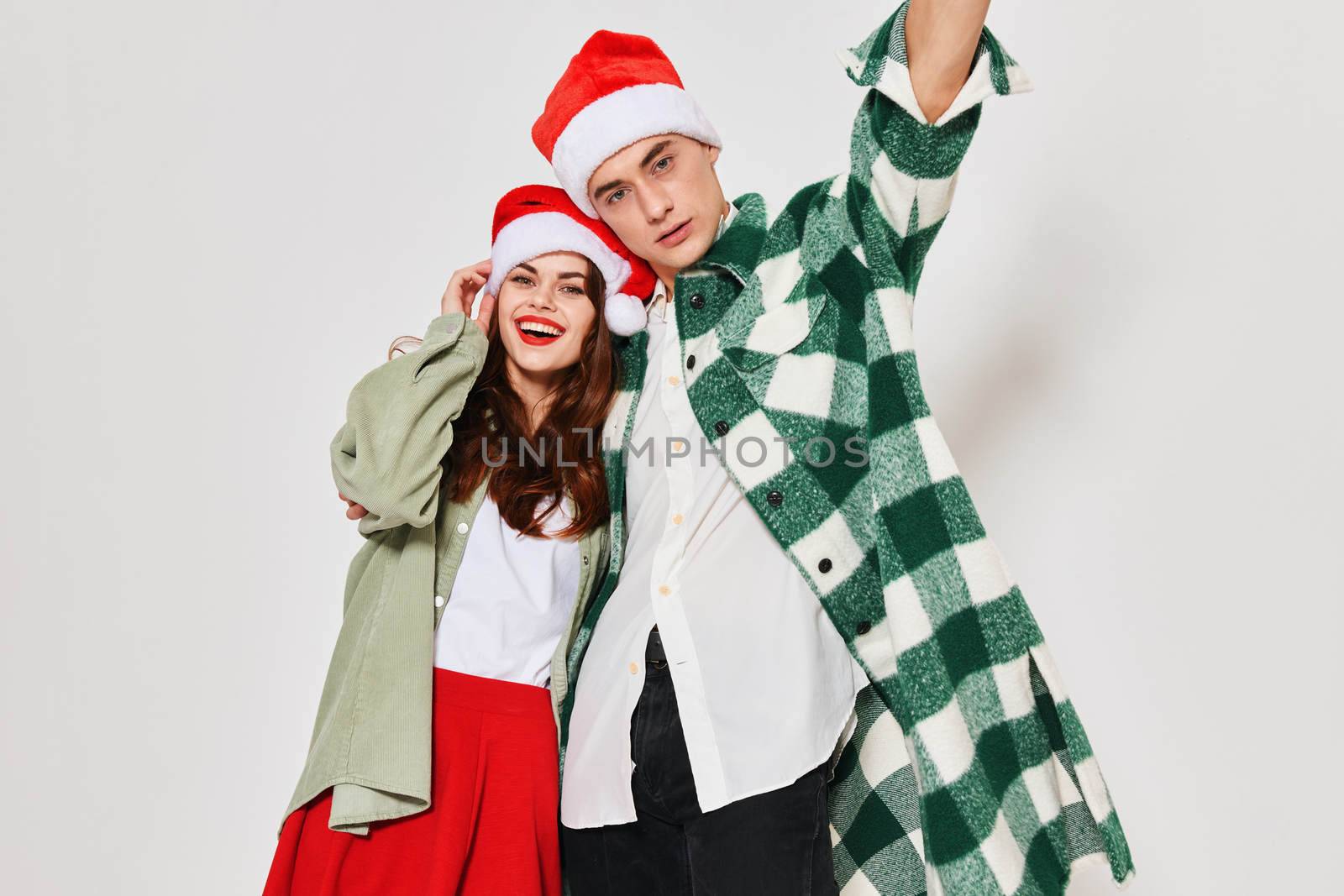 young fashionable couple new year holiday hug studio fun. High quality photo