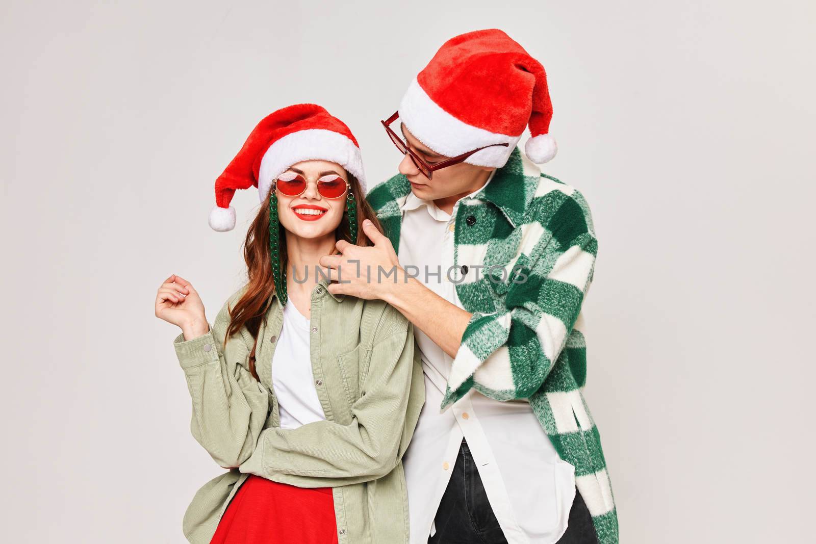 Man hugs woman New Years holiday fun dark glasses by SHOTPRIME