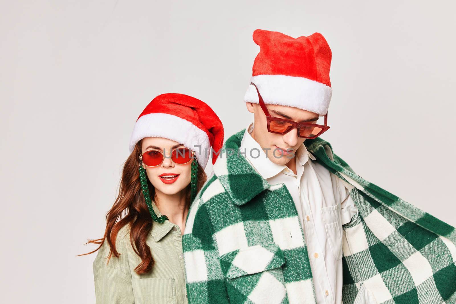 Man and woman New Years Style Holiday studio close-up sunglasses by SHOTPRIME