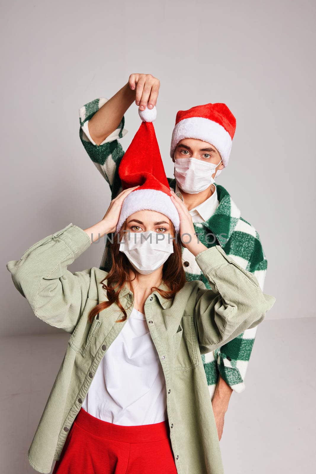 Married couple Christmas fun holiday medical masks. High quality photo