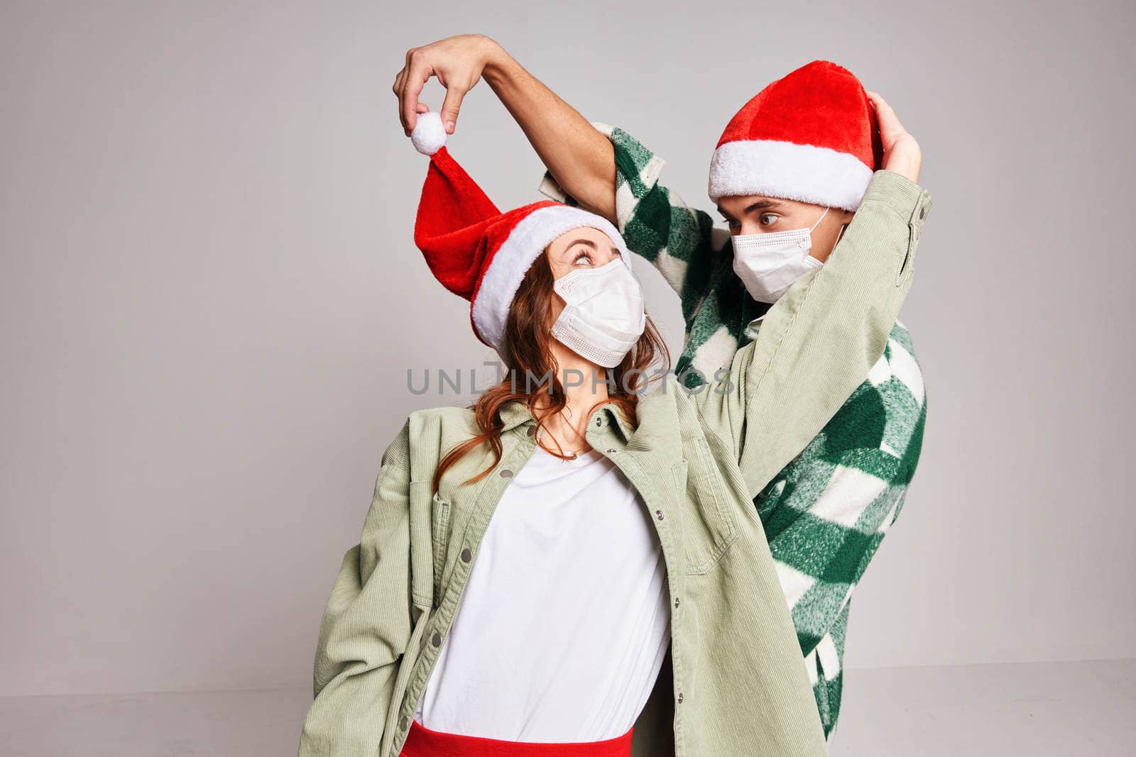 merry couple christmas new year fun medical masks holiday. High quality photo