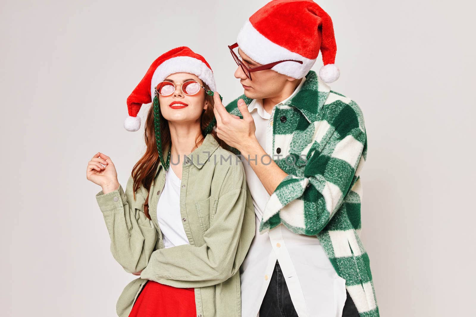 man and woman christmas hat fun holiday christmas sunglasses. High quality photo