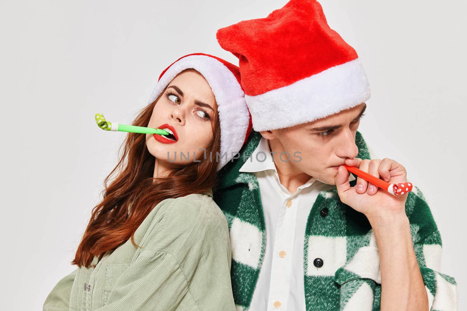 young couple festive pipes fun fashion christmas eve. High quality photo