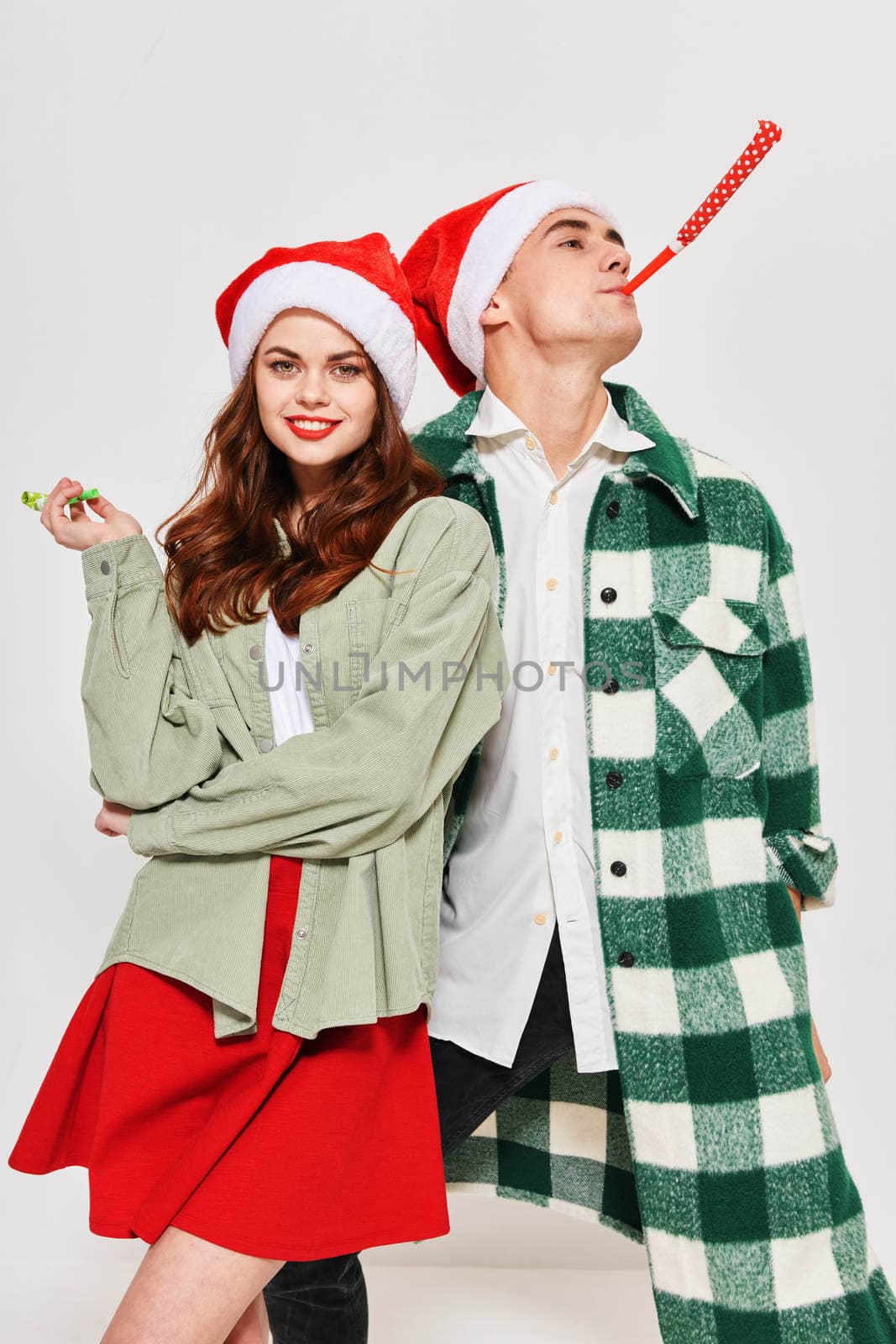 Young couple festive pipe Merry Christmas Fun Together Studio by SHOTPRIME