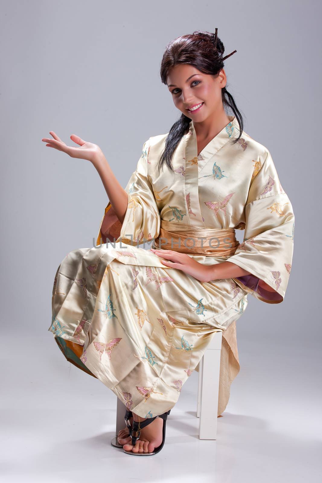Young Beautiful Woman In Japanese National Clothing by Fotoskat
