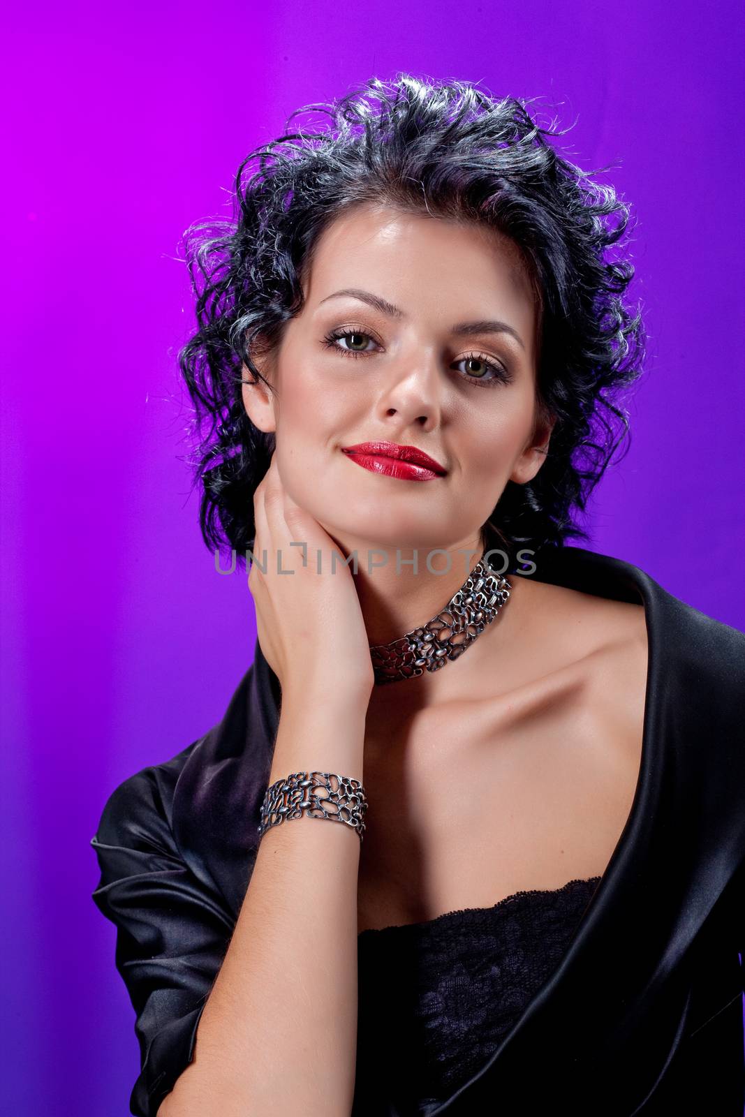 Young beautiful woman on a studio background