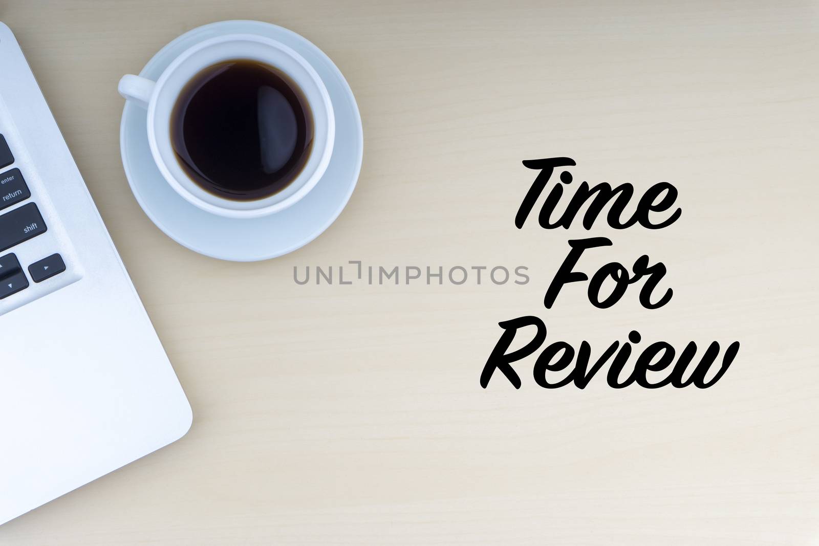 TIME FOR REVIEW text with laptop and cup of coffee on wooden background. Business and copy space concept.
