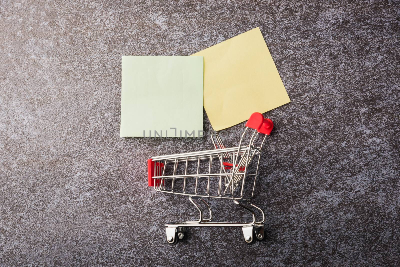 Blank paper stick note list with the shopping cart by Sorapop