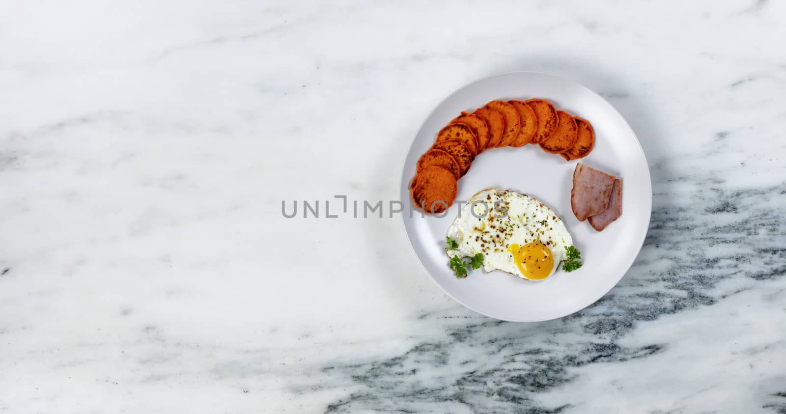 Fresh breakfast with healthy sweet potatoes, egg and fried ham by tab1962