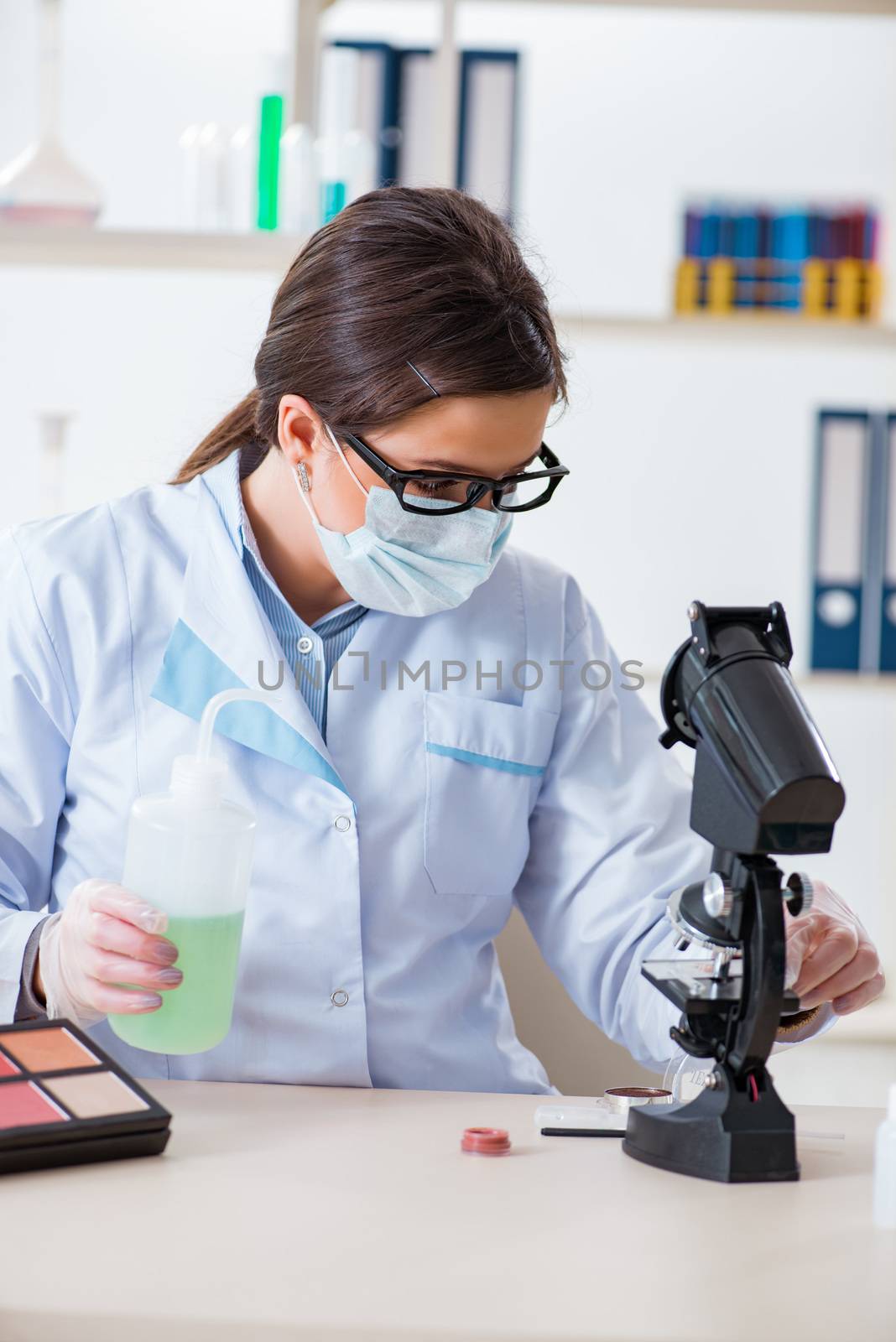 Lab chemist checking beauty and make-up products by Elnur