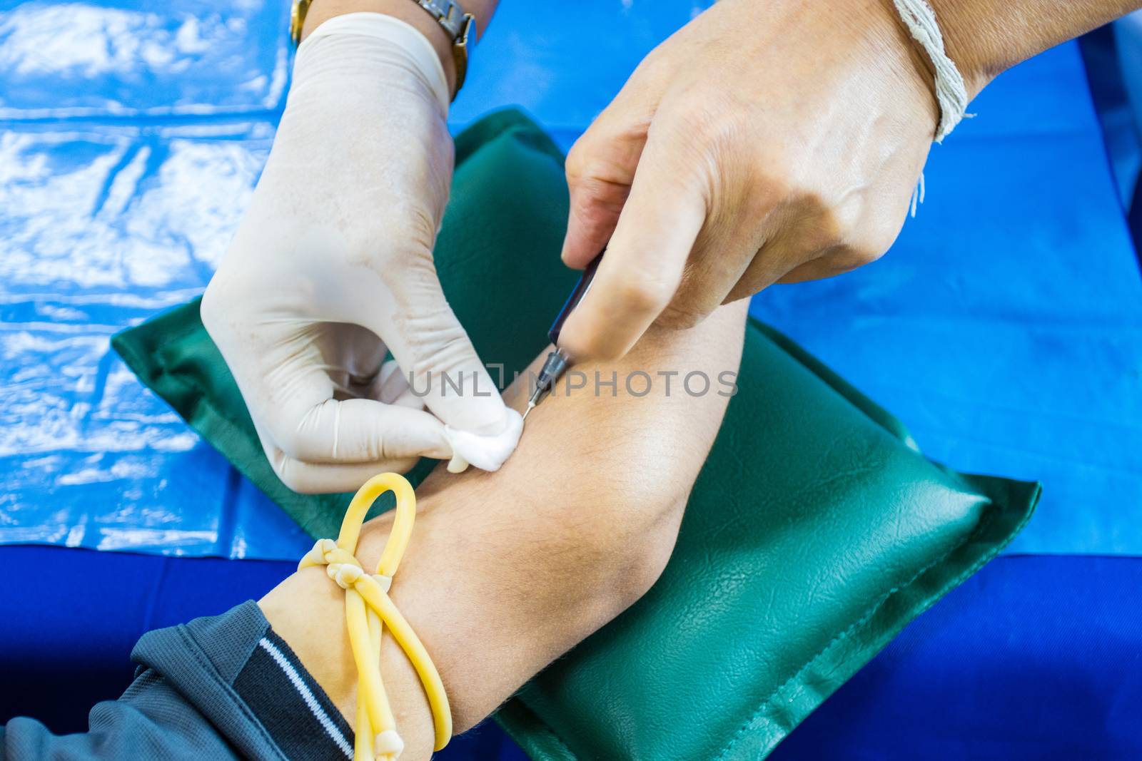 doctor injection needle on arm to collect blood for test the health selective focus syringe