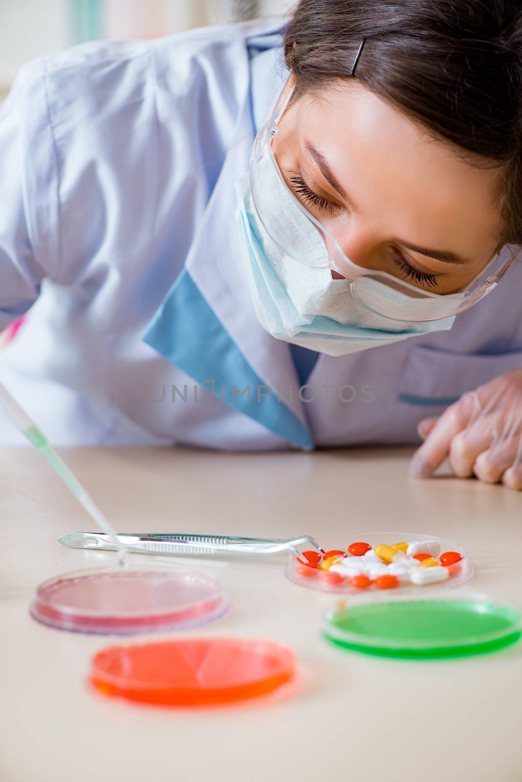 Lab assistant in drug synthesis concept