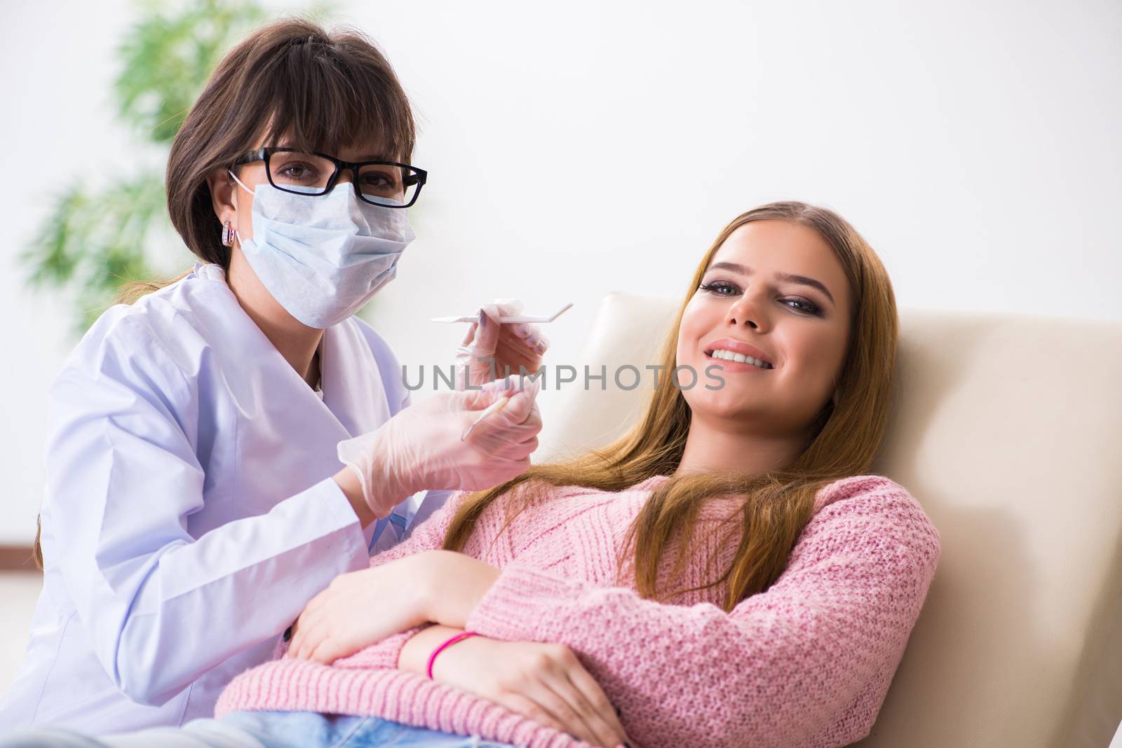 Woman patient visiting dentist for regular check-up