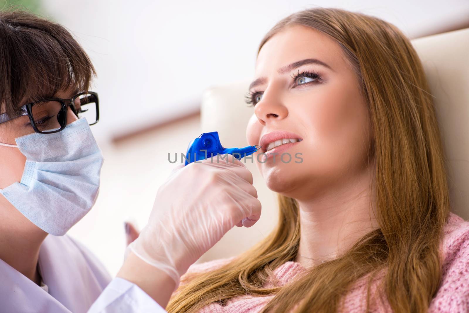 Young woman patient visiting dentist