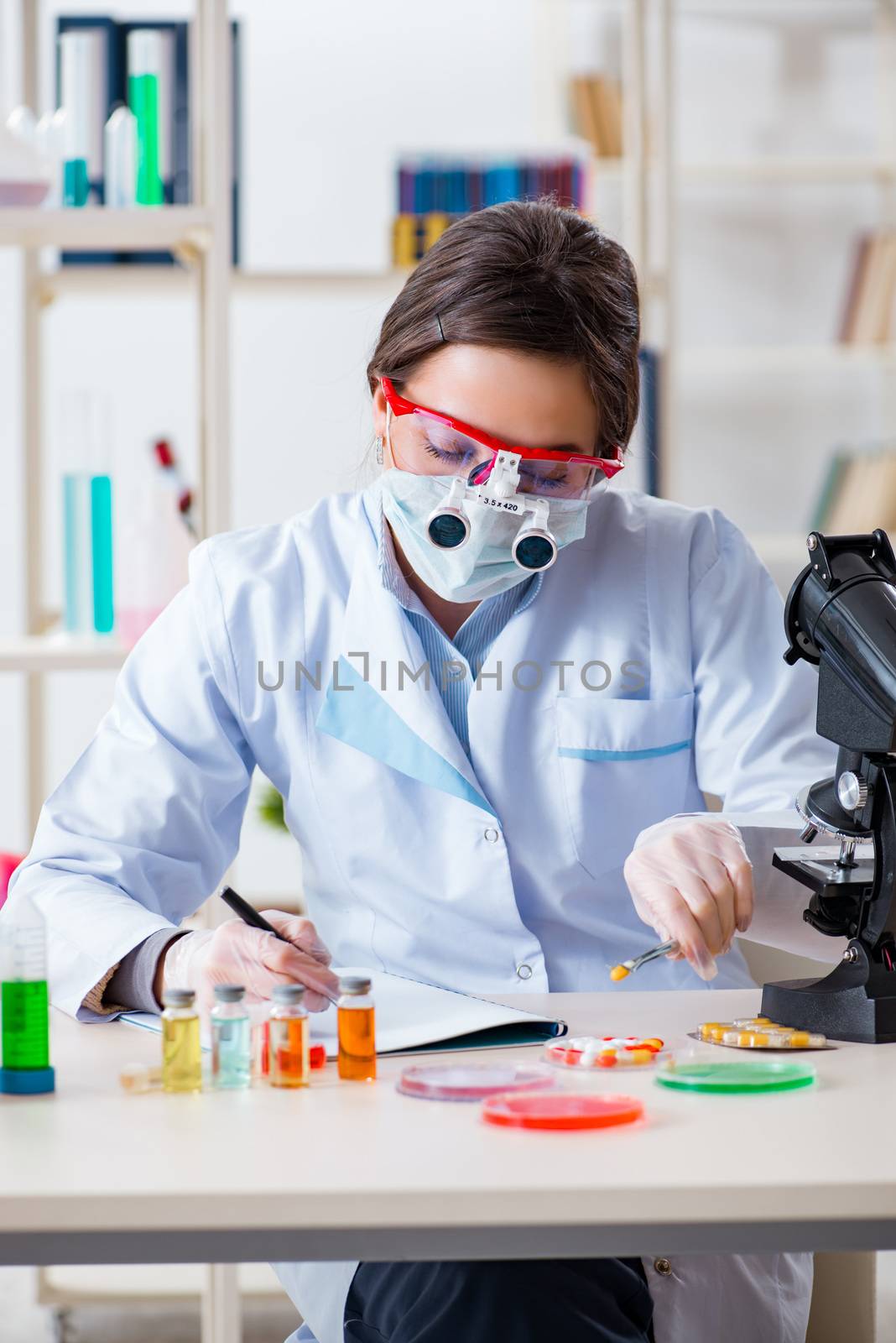 Lab assistant in drug synthesis concept