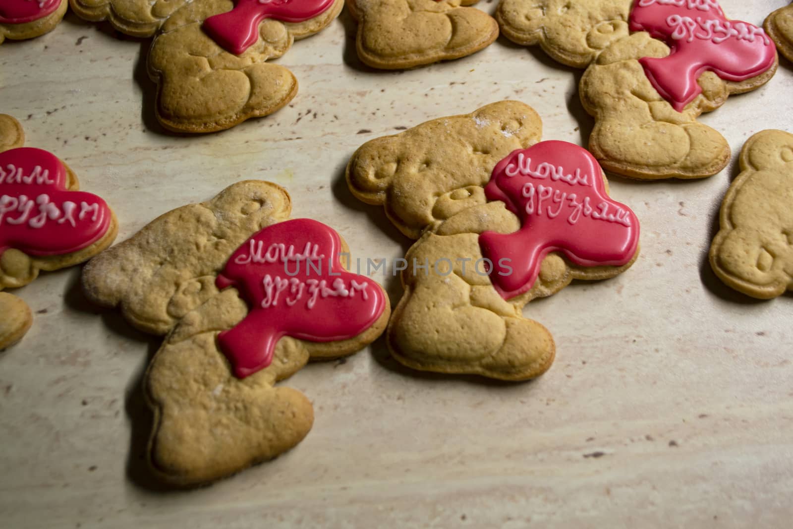 brown gingerbread cookies in the shape of bears with hearts by annaolgabymonaco