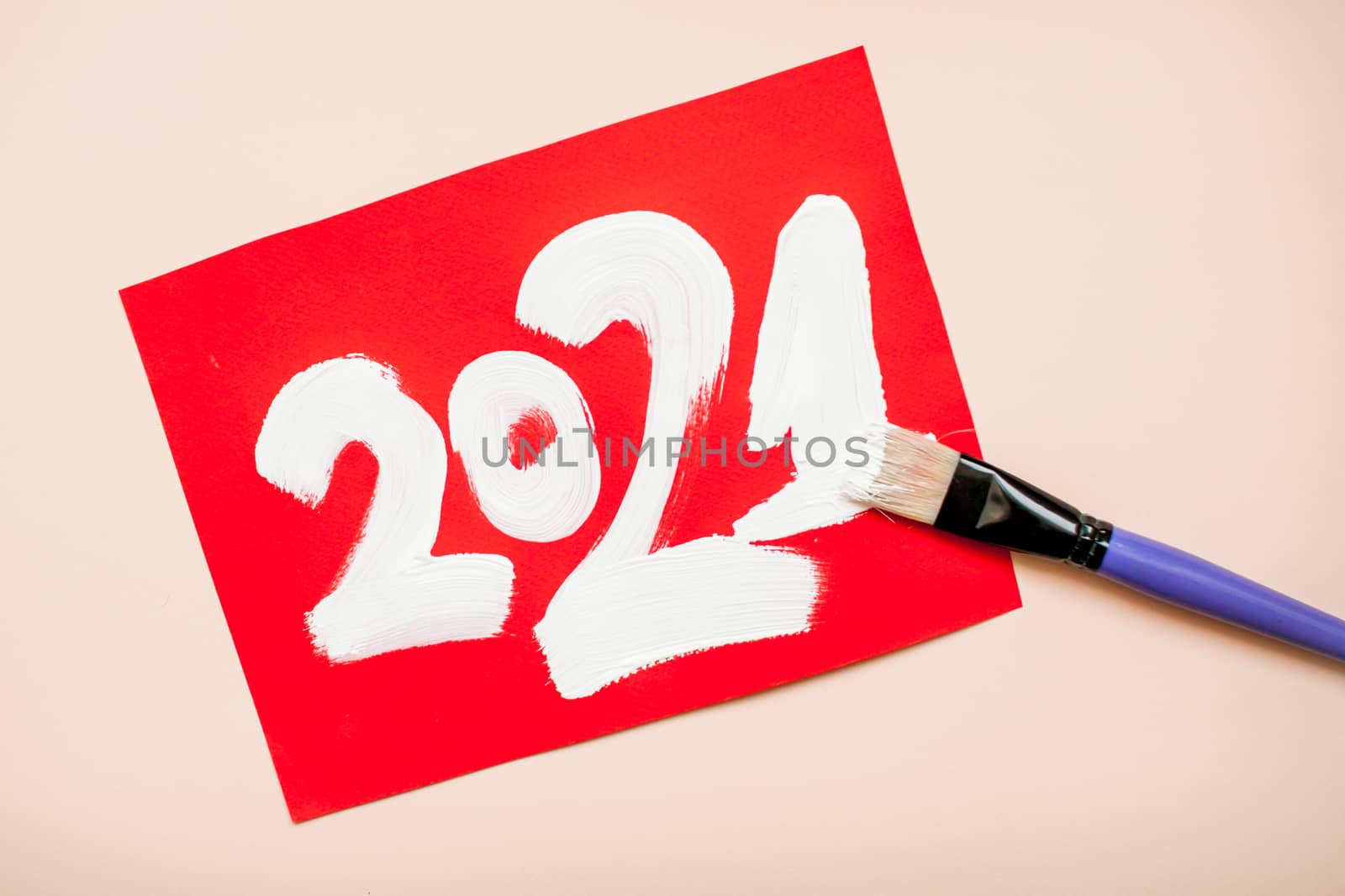 The numbers 2021 are written in white paint on a red sheet of paper. New Year by malyshkamju