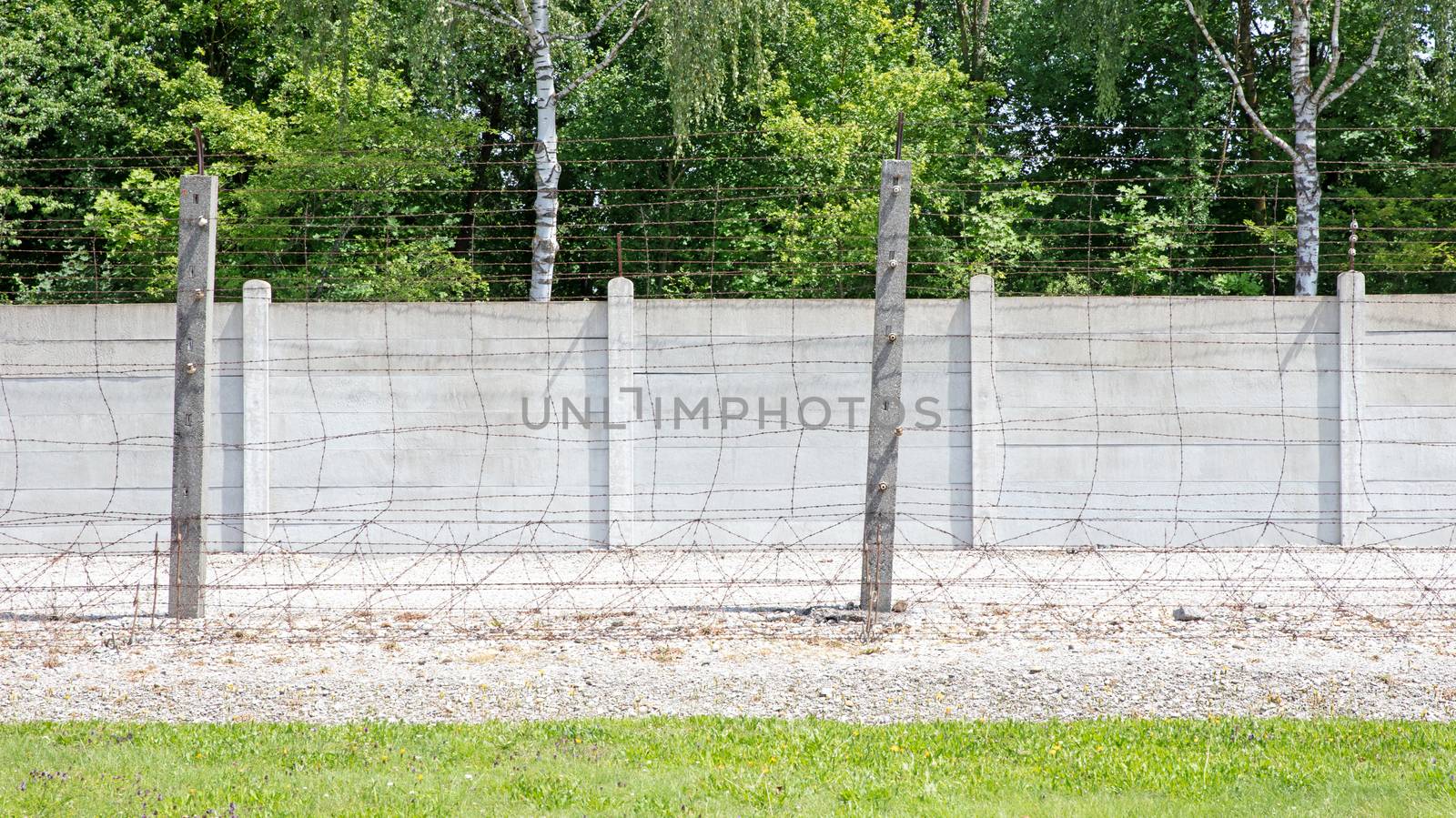 Dachau, Bavaria, Germany - July 13, 2020: Ditch and fence, Dachau Concentration Camp, near Munich, Bavaria, Germany, Europe