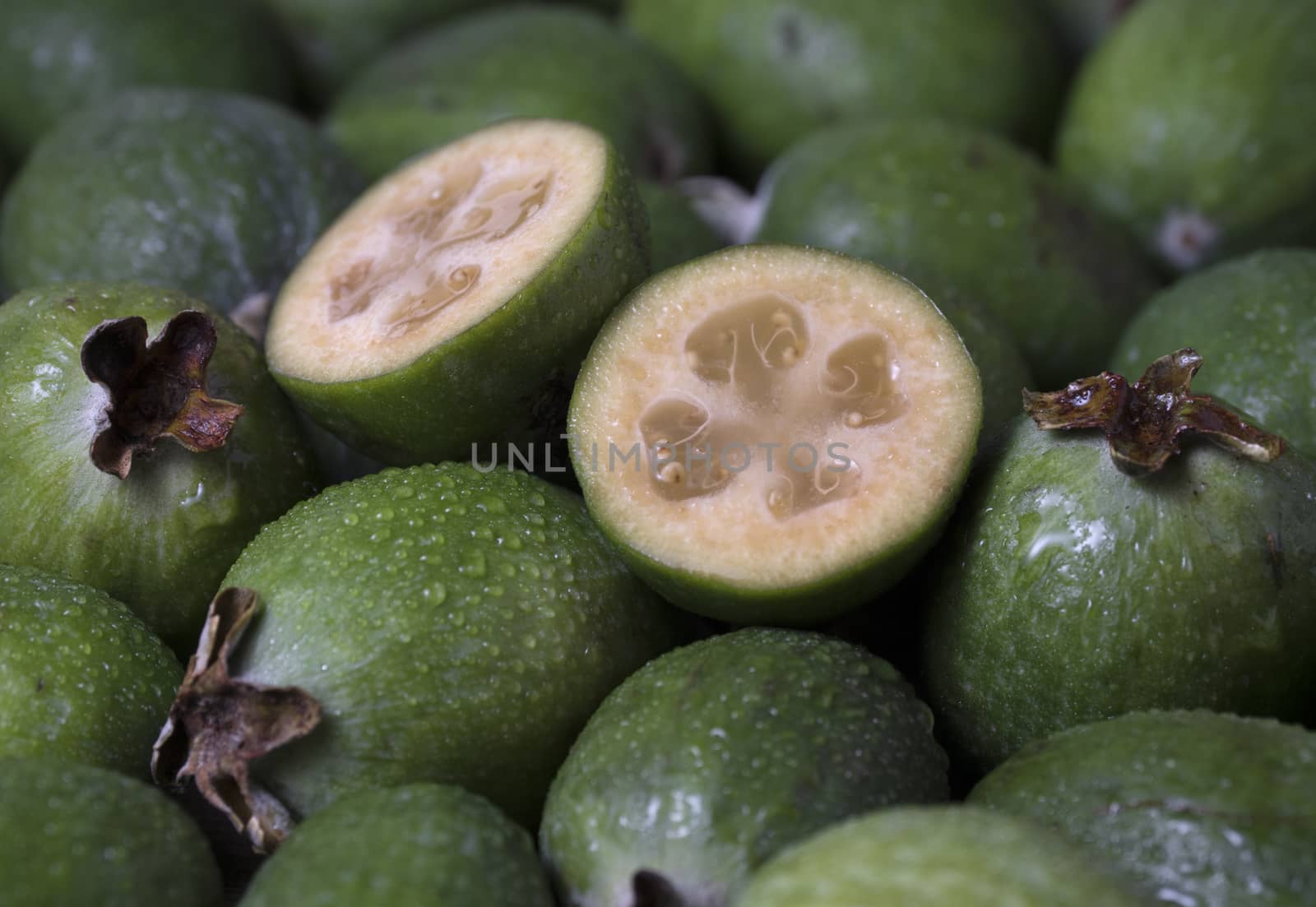 Fresh ripe sweet feijoa fruits. Healthy food background.