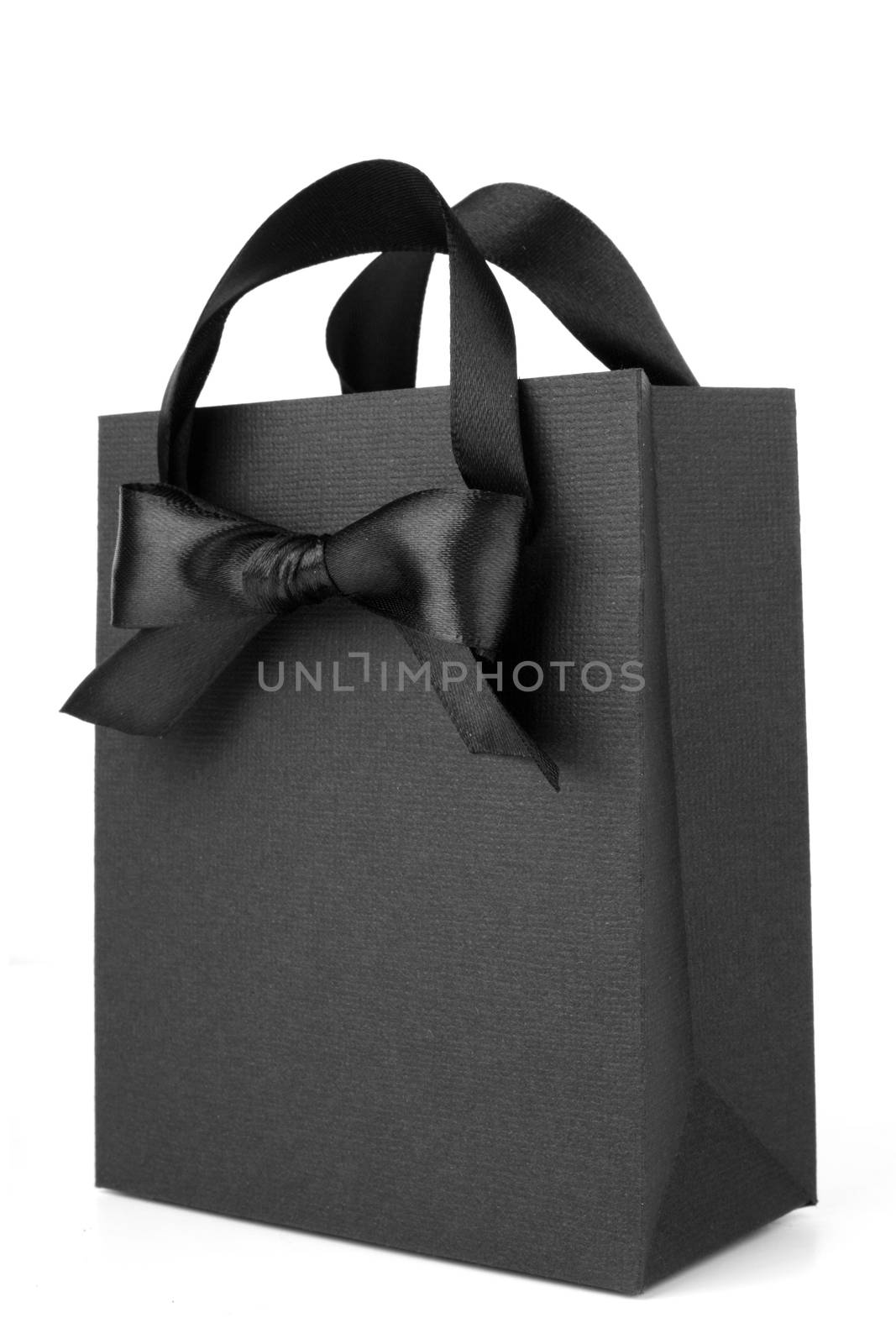 Black Friday paper bag with ribbon bow isolated on white background sale concept