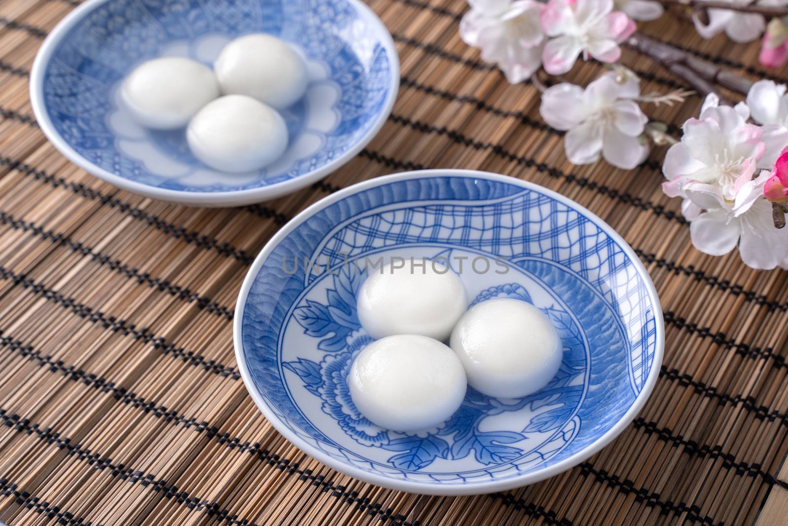 Close up of big tangyuan yuanxiao (glutinous rice dumpling balls) for Winter Solstice festival food on gray table background.