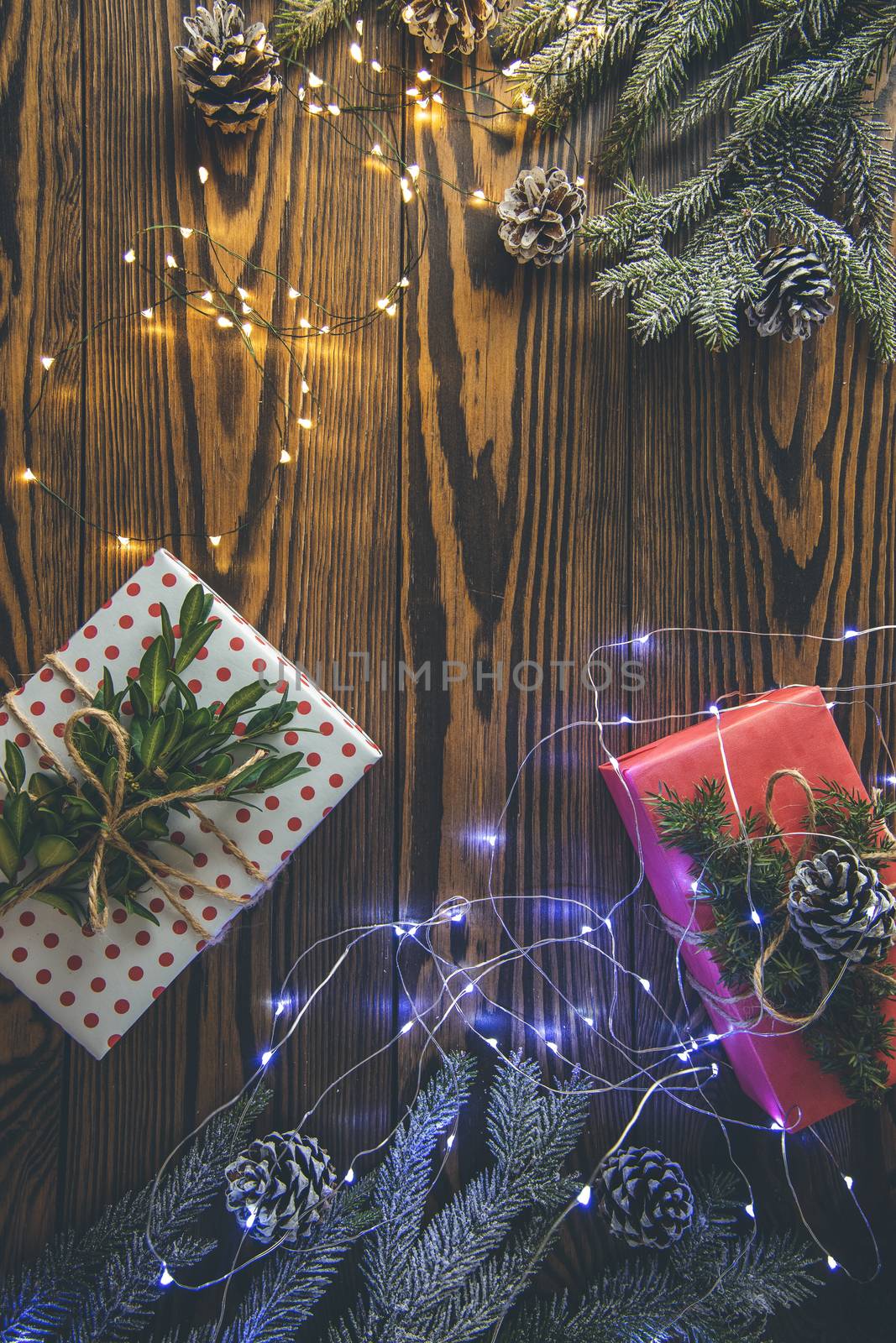 Christmas background with gift box wrapped in holiday paper over by ArtSvitlyna