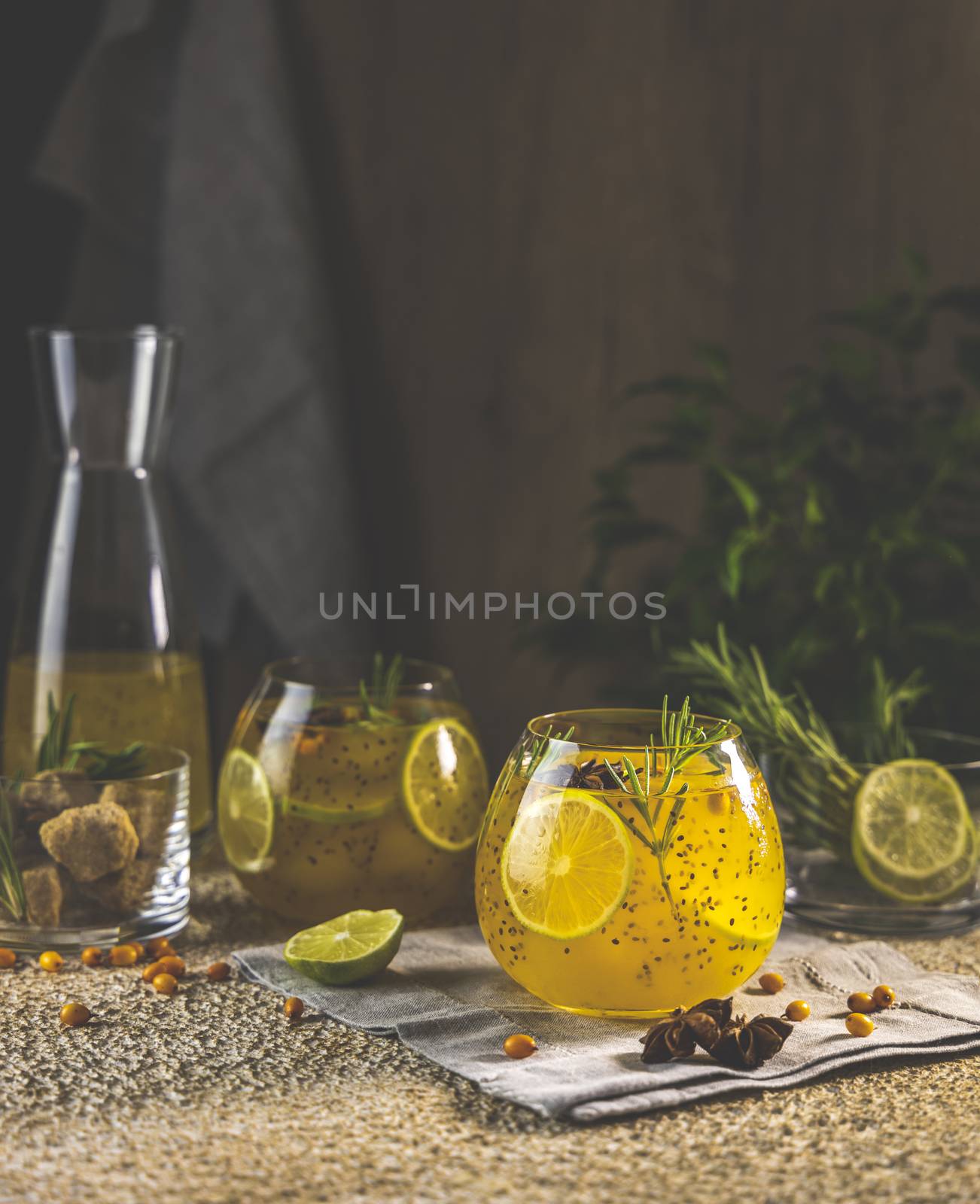 Homemade fruit tea with sea buckthorn, lime, rosemary, star anise and chia seeds for autumn and winter holidays - festive Christmas, Thanksgiving drinks. Healthy food life.