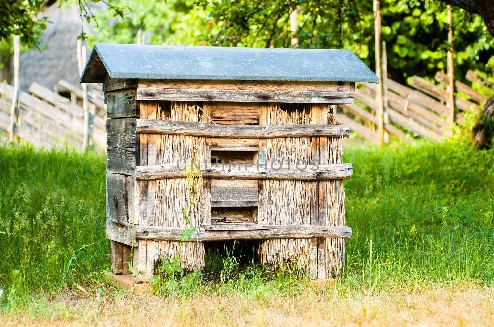 Traditional beehive from old times, made of wood. Old beehive in the apiary. Nature beehive beekeeping countryside honey