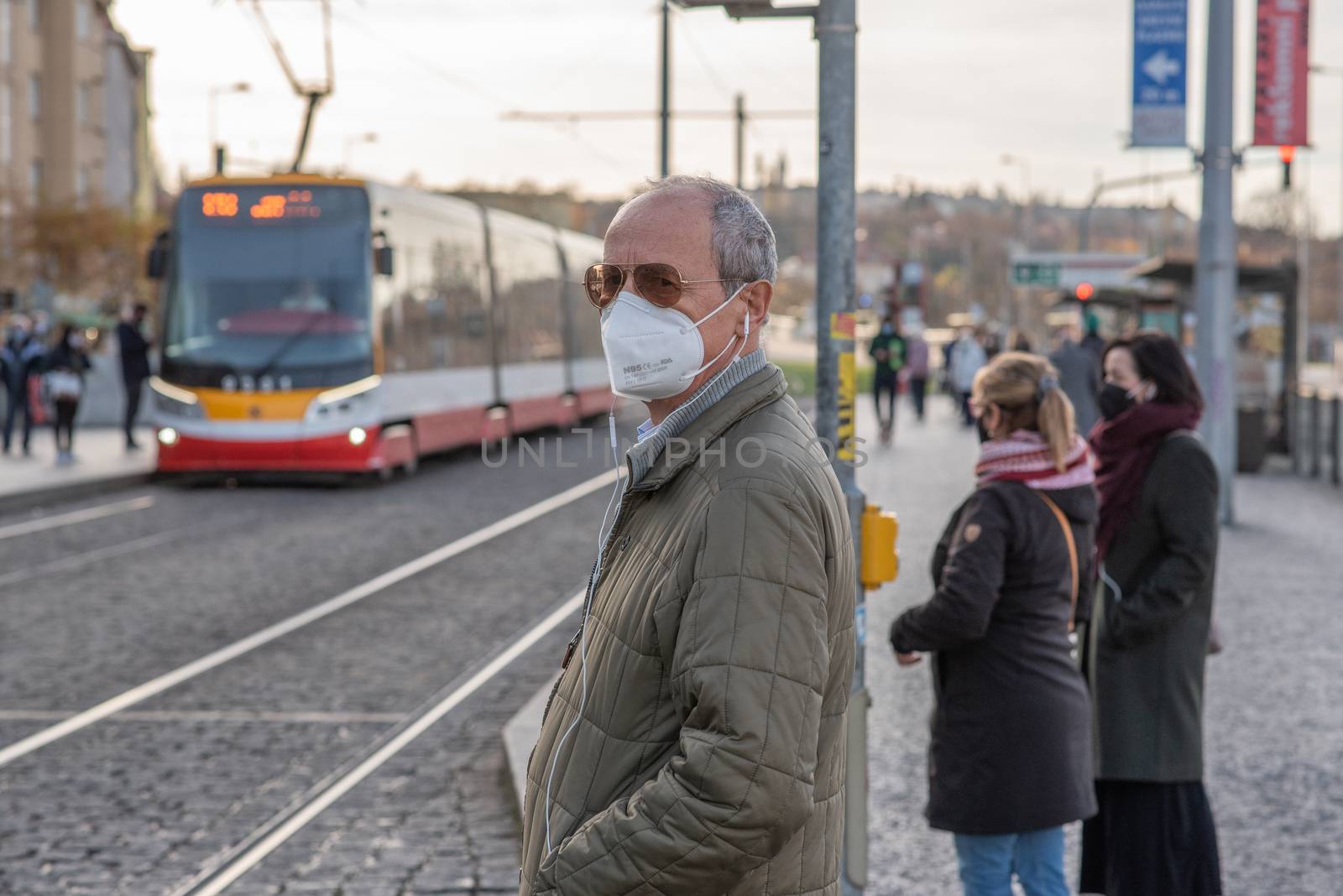 People on a winter day facing quarantine. Man, woman, mums, child, old and young people outdoors. Prague 6 by gonzalobell