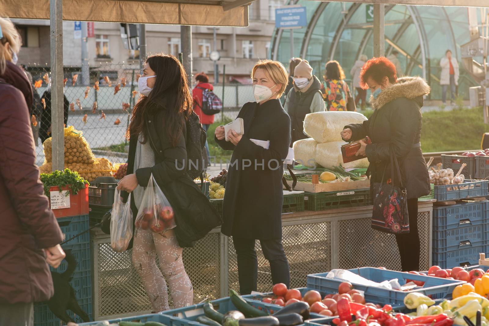 People on a winter day facing quarantine. Man, woman, mums, child, old and young people outdoors. Prague 6 by gonzalobell