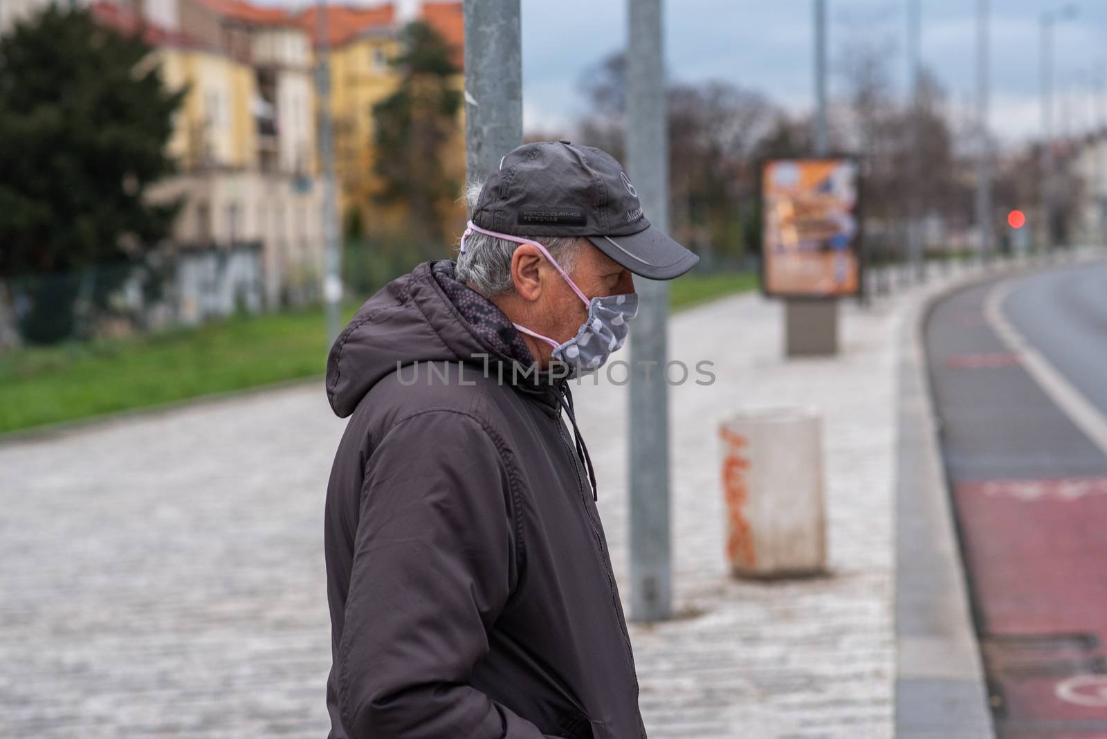 People on a winter day facing quarantine. Man, woman, mums, child, old and young people outdoors. Prague 6 by gonzalobell