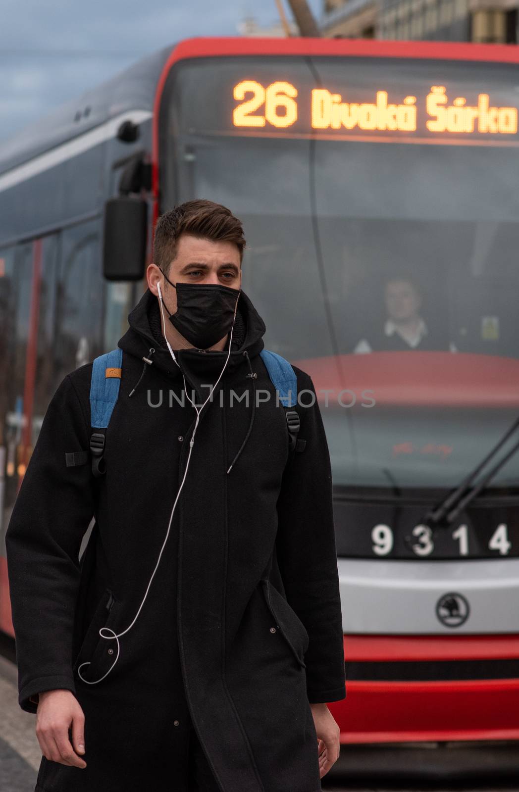 11-23-2020. Prague, Czech Republic. People walking and talking outside during coronavirus (COVID-19) at Hradcanska metro stop in Prague 6. Man walking with mask at station.