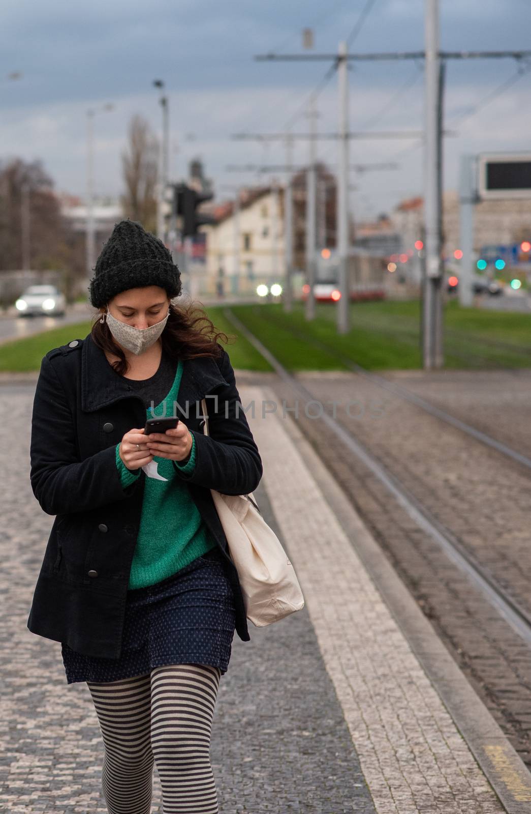 People on a winter day facing quarantine. Man, woman, mums, child, old and young people outdoors. Prague 6 by gonzalobell