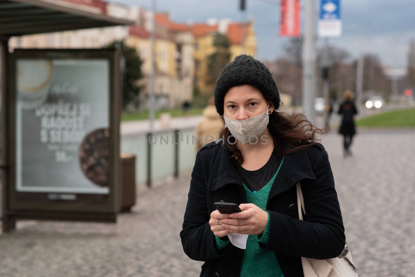 People on a winter day facing quarantine. Man, woman, mums, child, old and young people outdoors. Prague 6 by gonzalobell