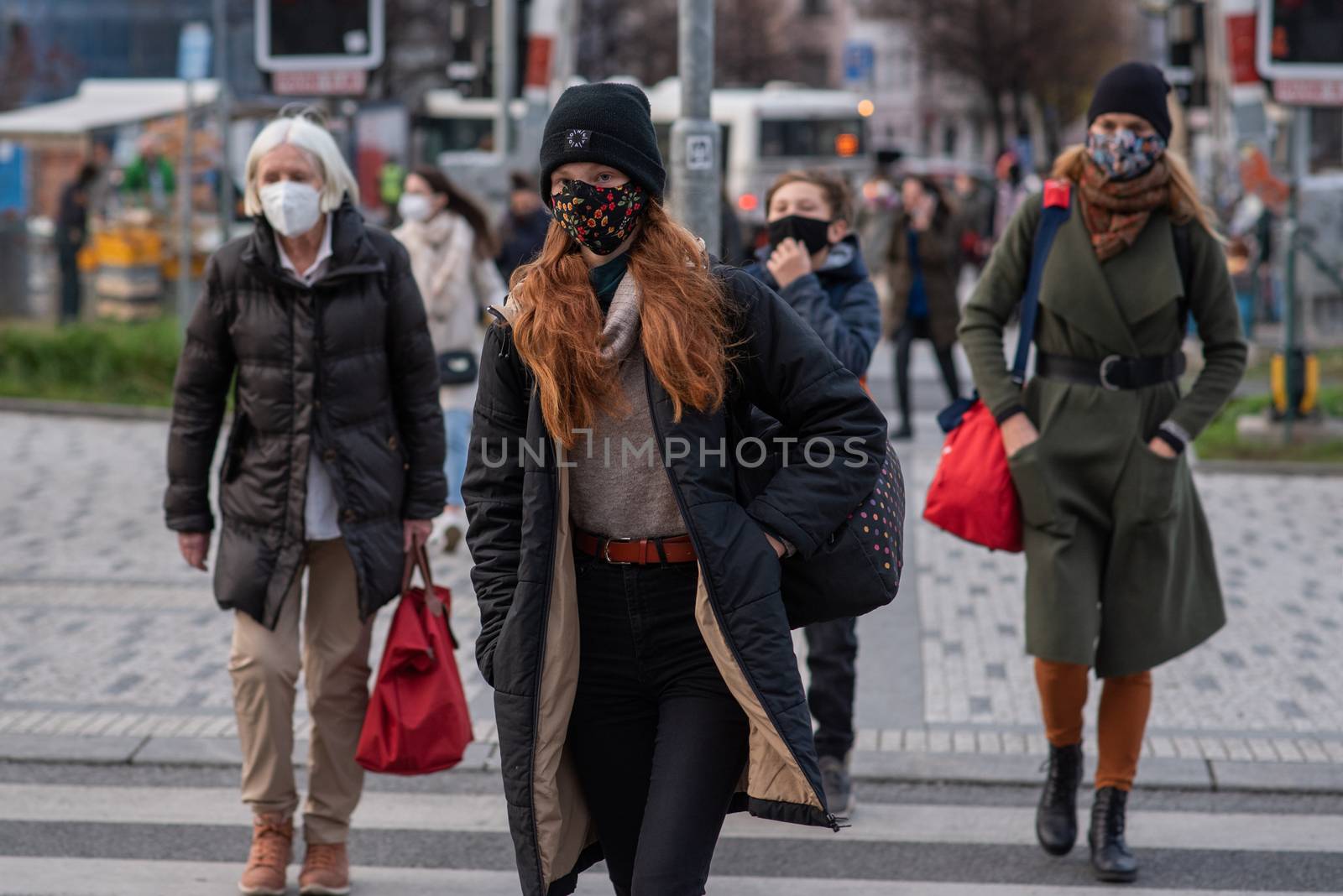 People on a winter day facing quarantine. Man, woman, mums, child, old and young people outdoors. Prague 6 by gonzalobell