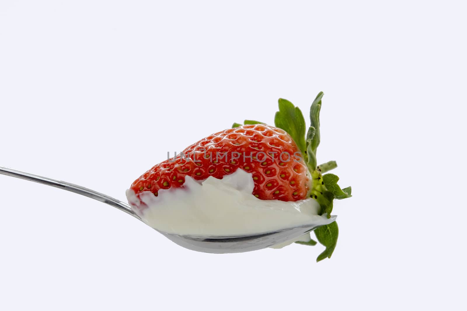 Strawberries in a spoonful of sour cream by ben44