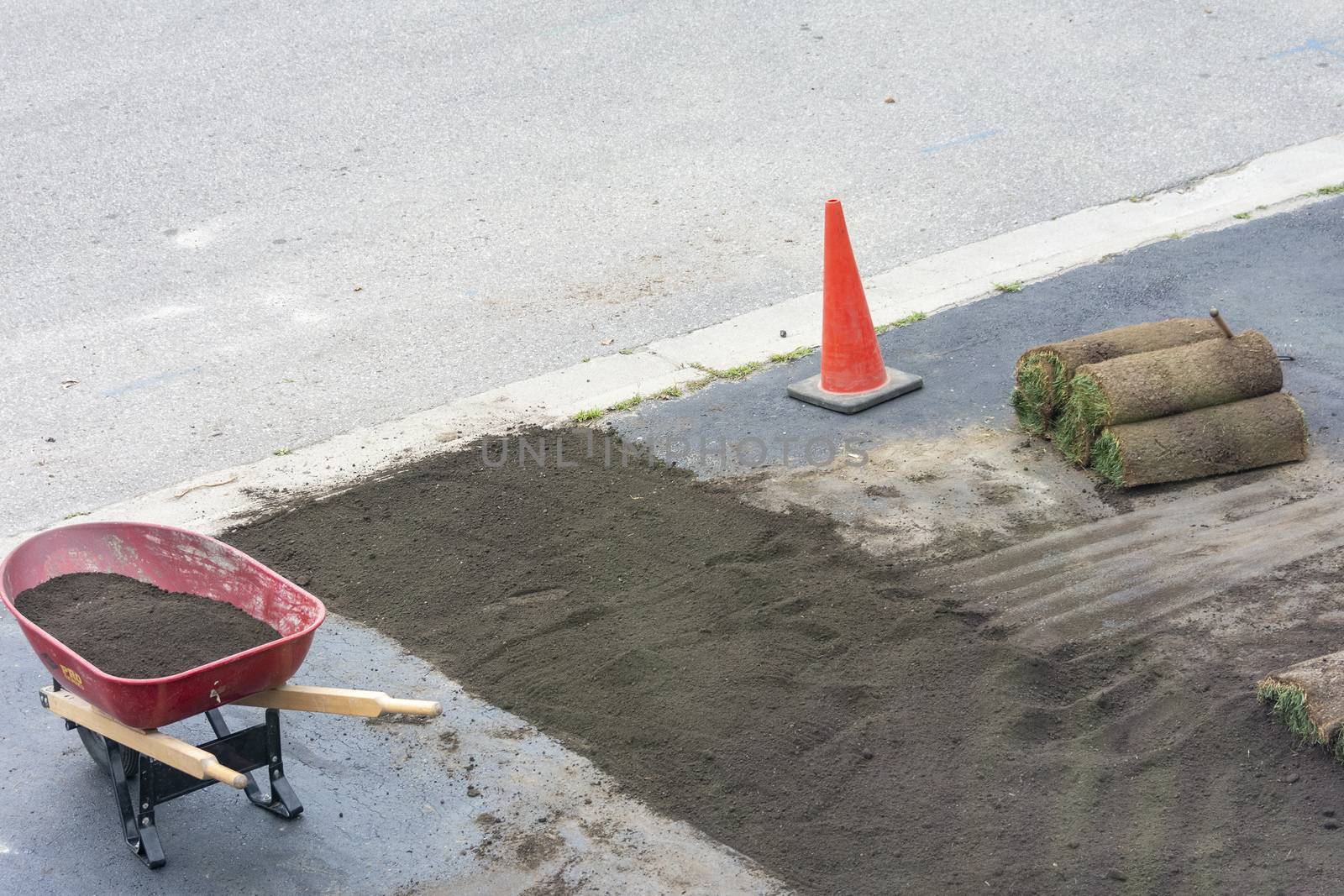 Preparing an area with filled, moist soil and compaction of the soil for planting new grass