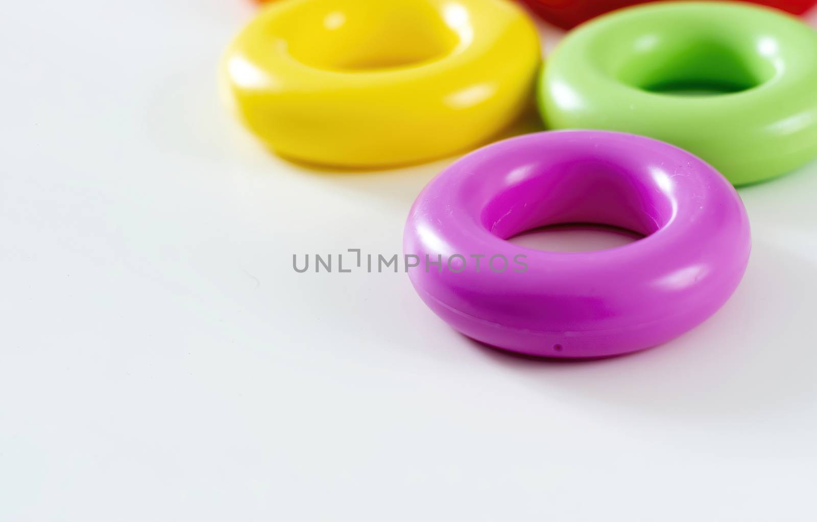 colorful plastic rings isolated on a white background. Children's toys. Same size for each ring