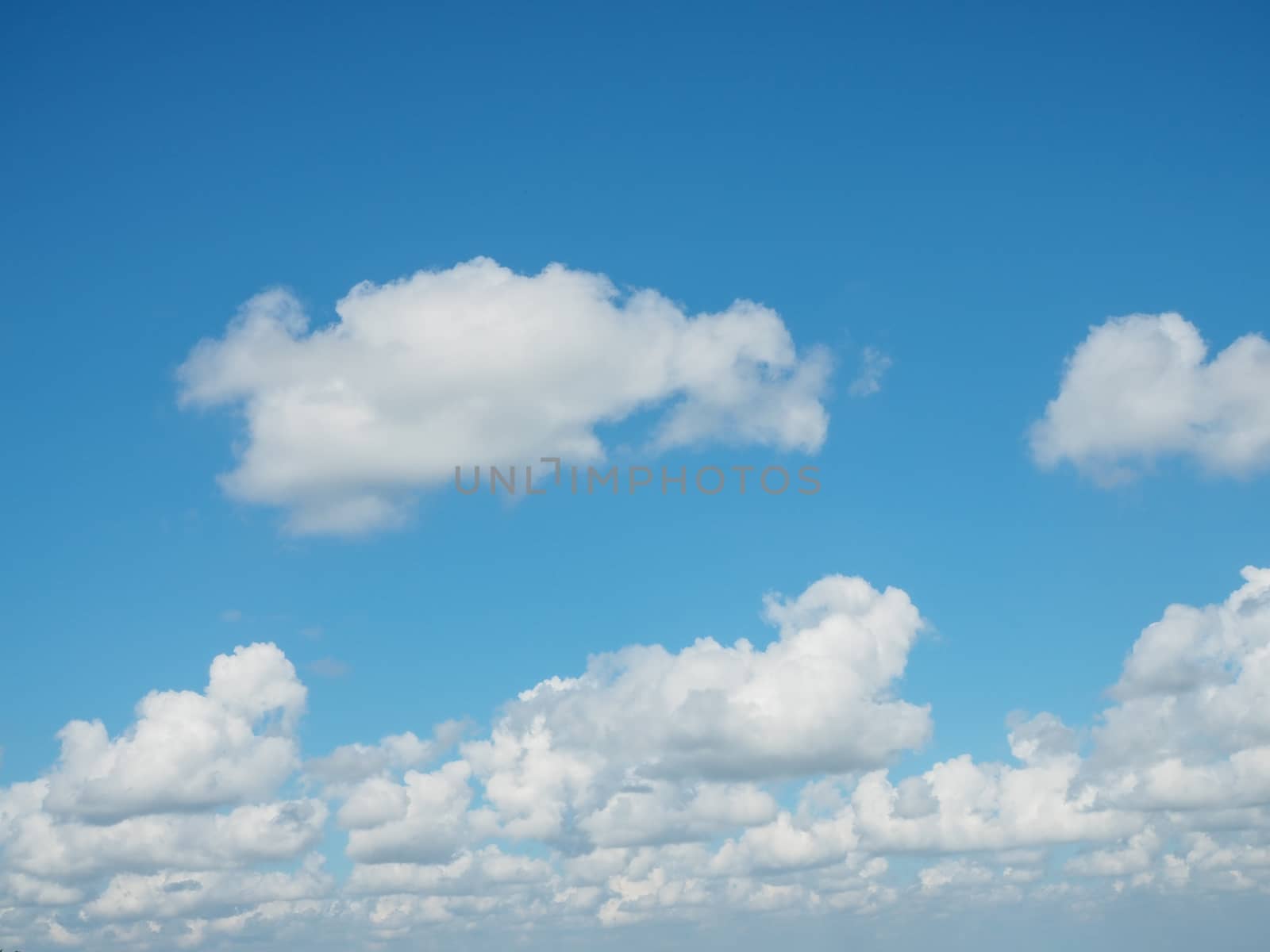 A panoramic view of the bright blue sky in the afternoon. by Unimages2527