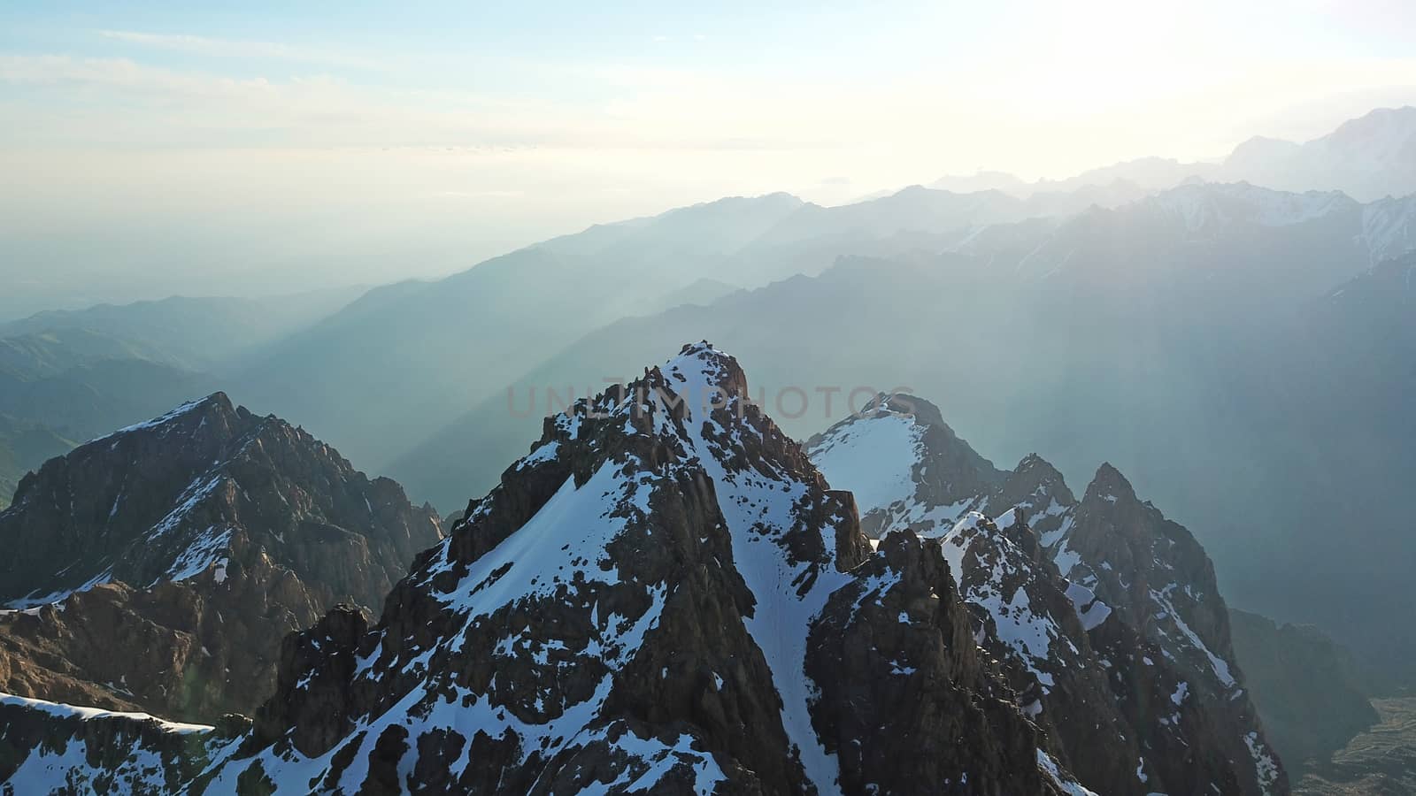 Huge snow mountains. View from a drone. by Passcal