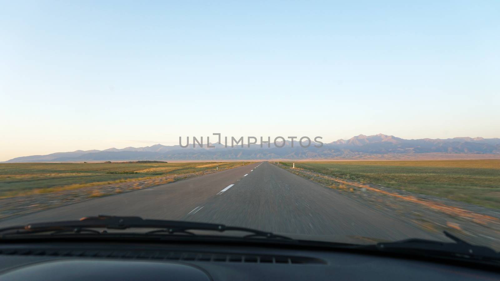 View through the windshield of the car on the road by Passcal