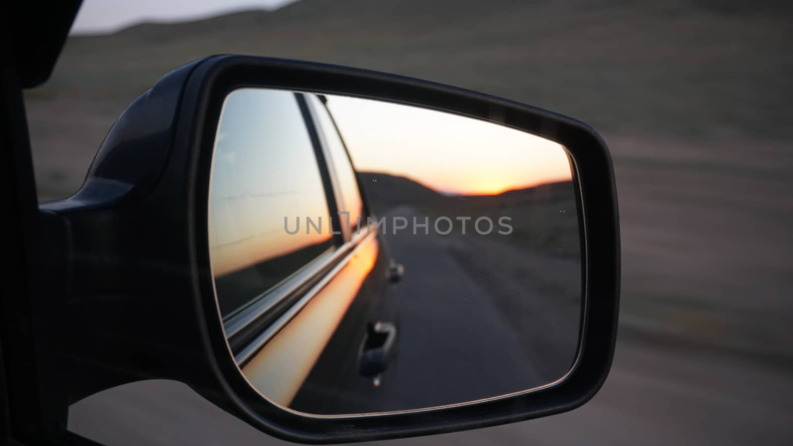 View in the side mirror of the car. by Passcal