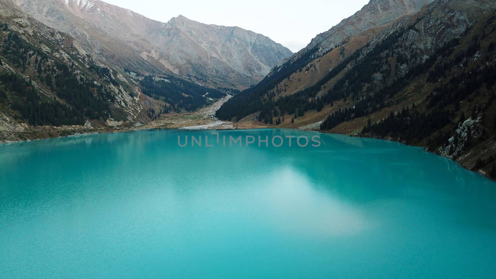 Big Almaty lake in the mountains. Green hill. by Passcal