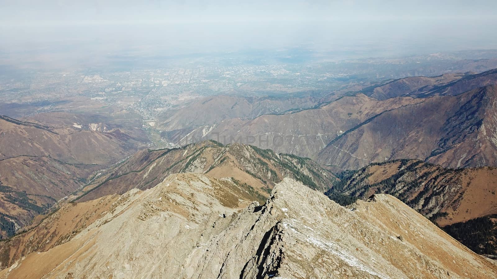 Mountain tops covered with snow. View from a drone by Passcal