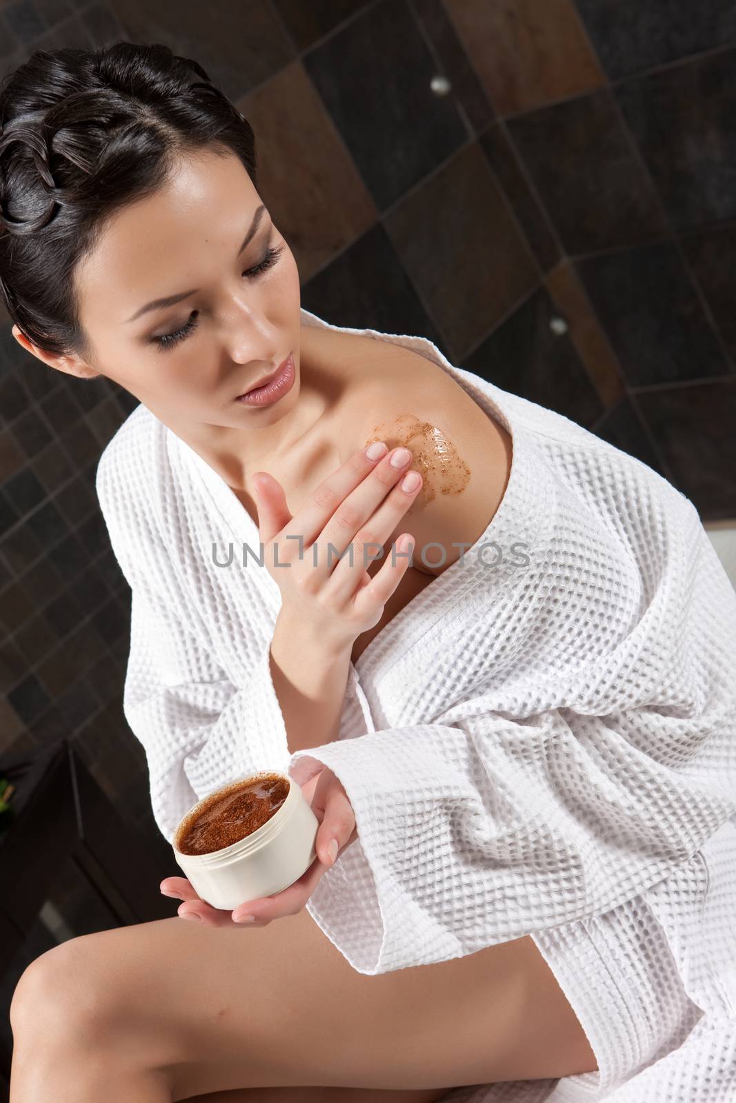 Young attractive woman taking massage and spa procedures